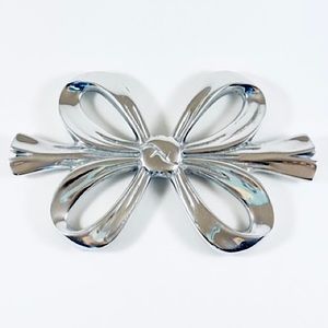 Handmade Mexican pewter ribbon bow trivet